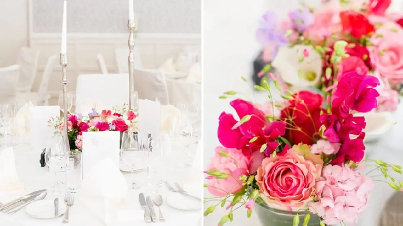 Festlich gedeckter Hochzeitstisch mit silbernen Kerzenhaltern und farbenfrohen Blumenarrangements in einer eleganten Hochzeitslocation in Stuttgart.